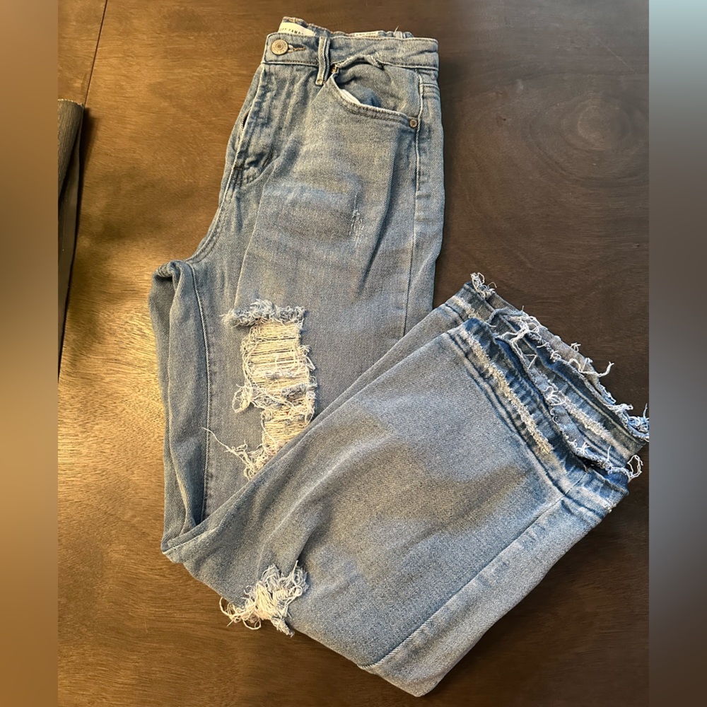 Almost famous distressed jeans.